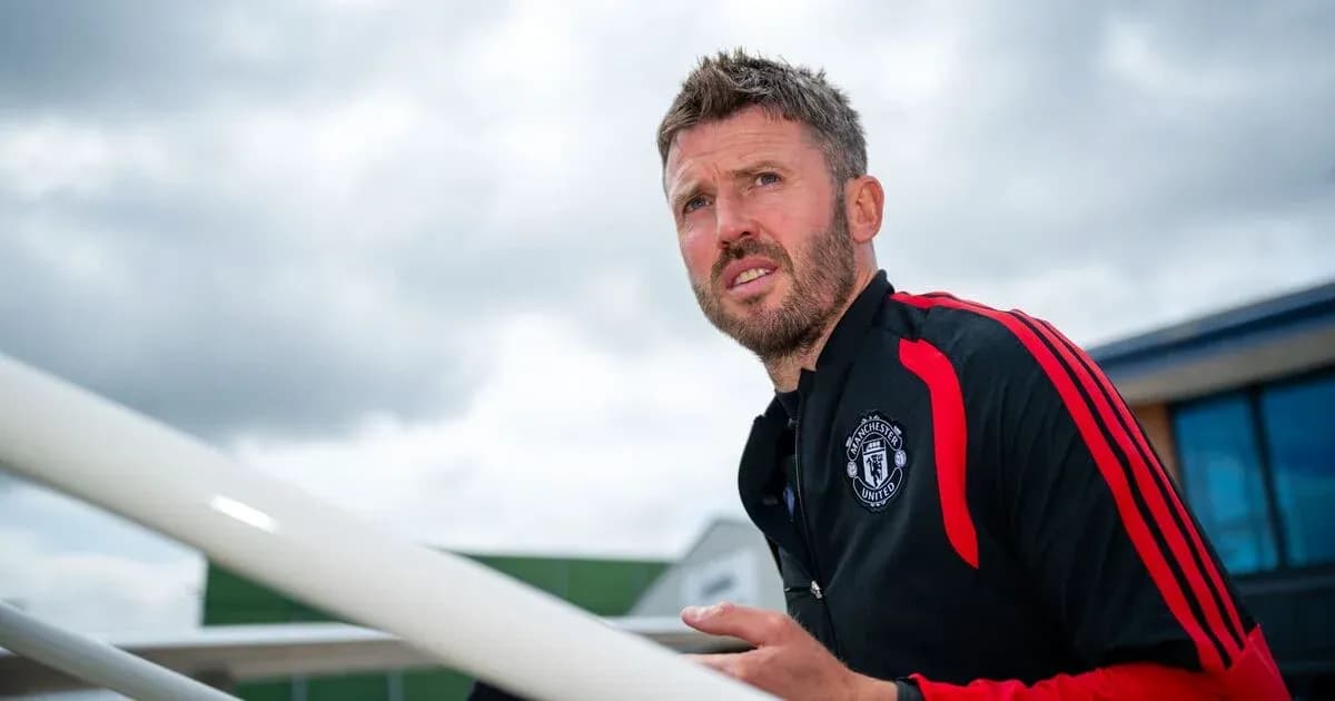 Coach in Manchester United training gear outdoors