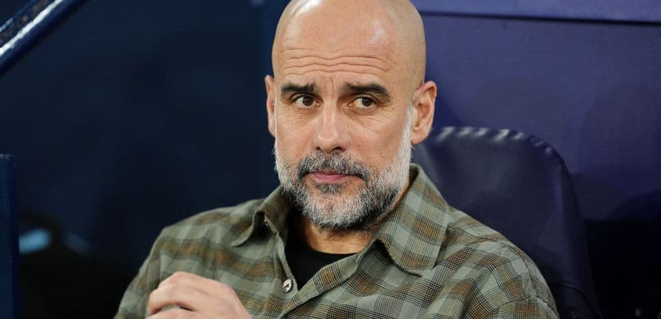 Coach sitting on bench during match preparation