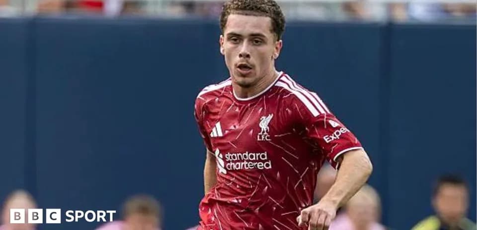 Player in Liverpool kit running on the pitch