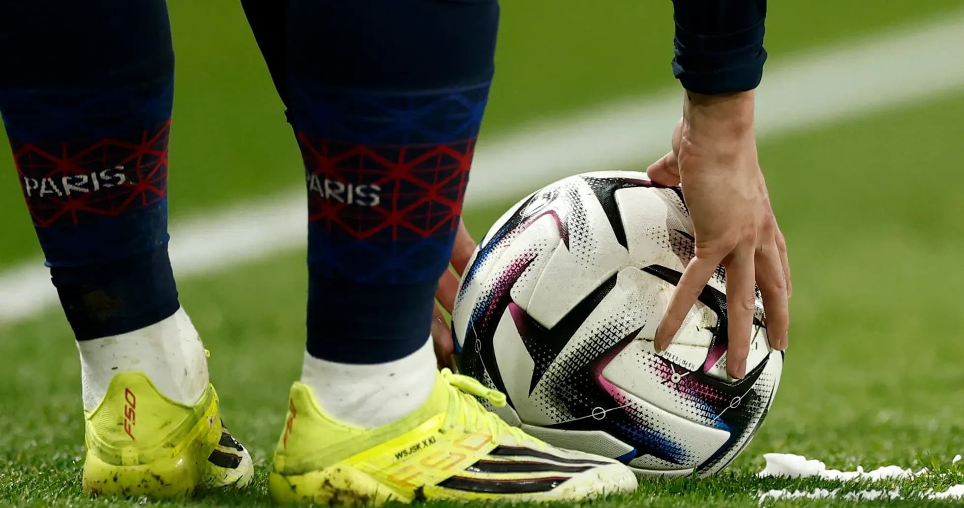 Player placing ball on field before kick