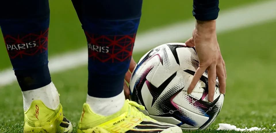 Player placing ball on field before kick