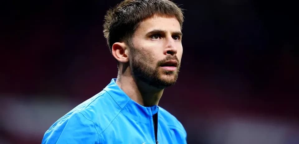 Player in blue training gear on the pitch