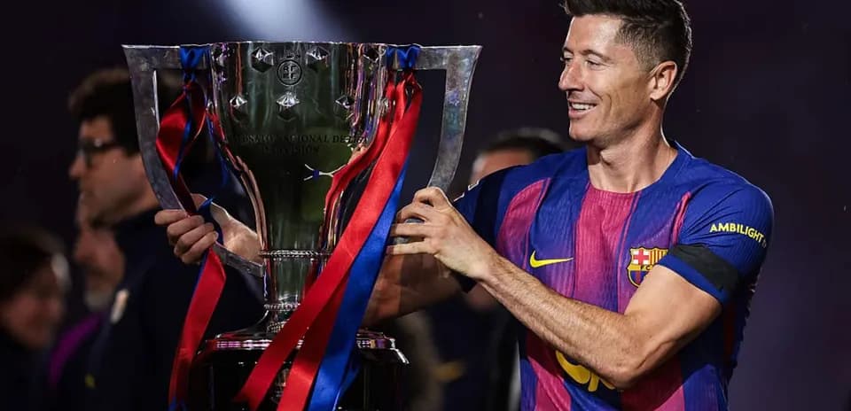 Player holding trophy after winning match