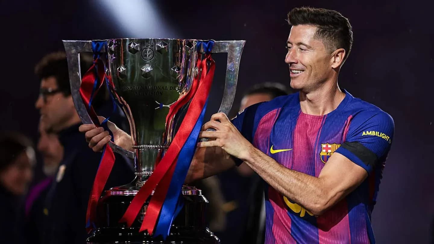 Player holding trophy after winning match