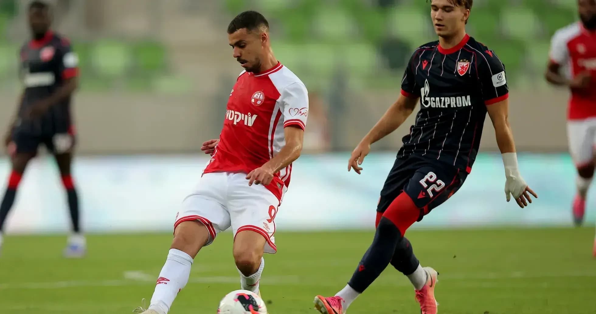 FK Crvena Zvezda player in action against opponent
