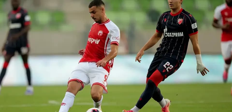 FK Crvena Zvezda player in action against opponent