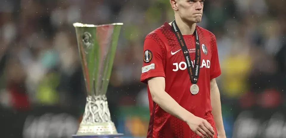 Player walking past trophy after match