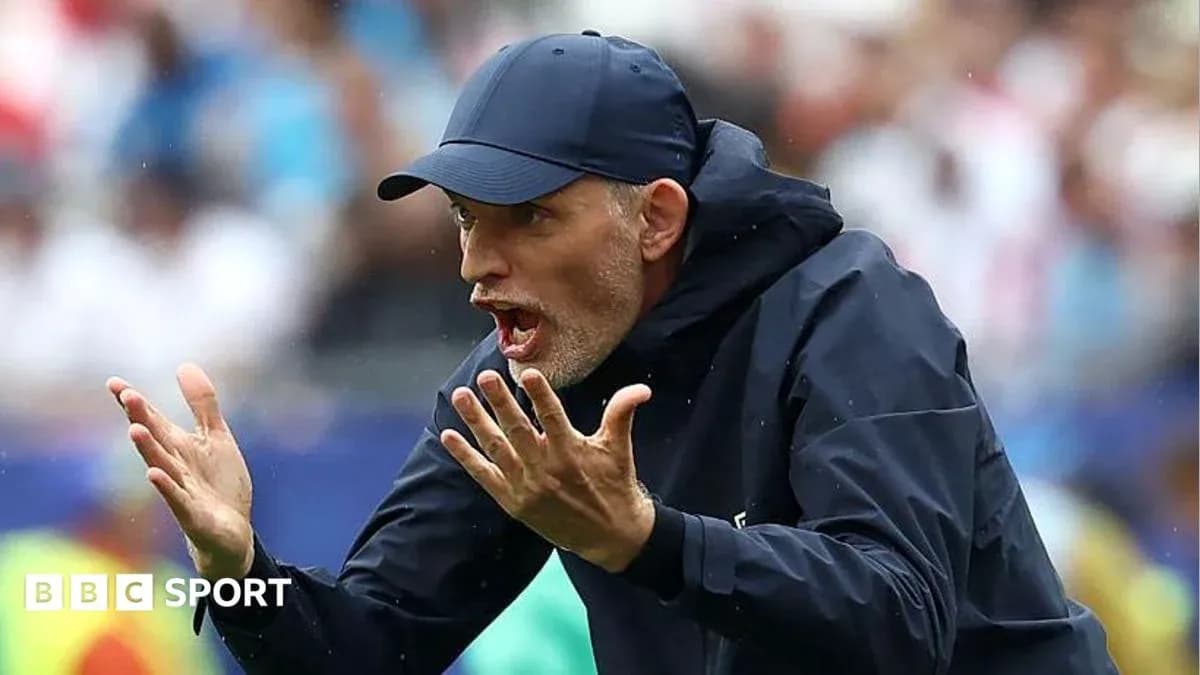 Coach gesturing on the sidelines during match