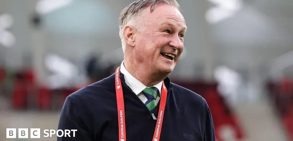 Coach smiling during pre-match event