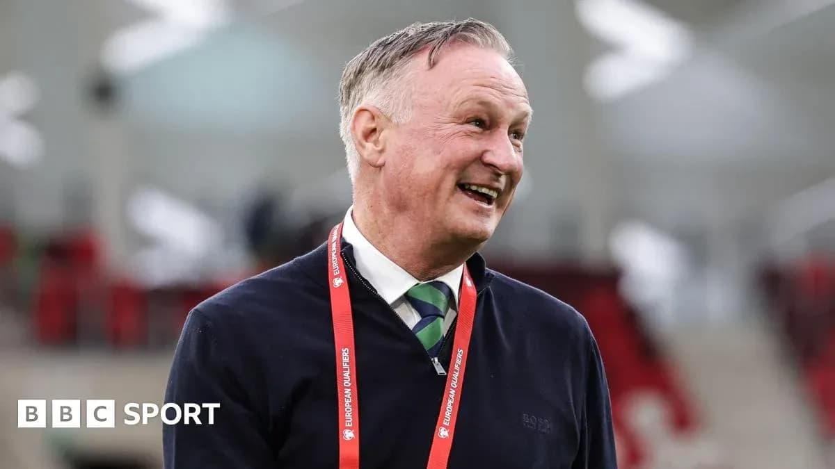 Coach smiling during pre-match event