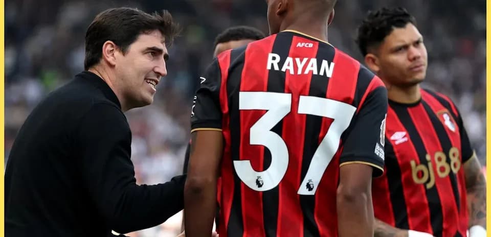 Coach discussing strategy with Bournemouth players during match