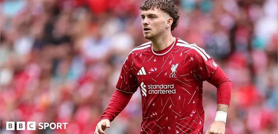 Player in Liverpool kit running on the pitch