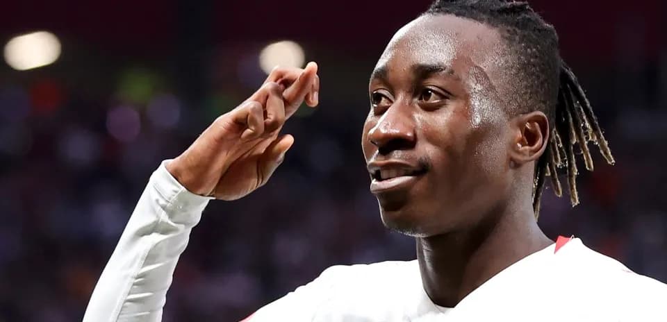 Player celebrating a goal with a salute gesture