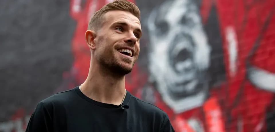 Player standing in front of mural background