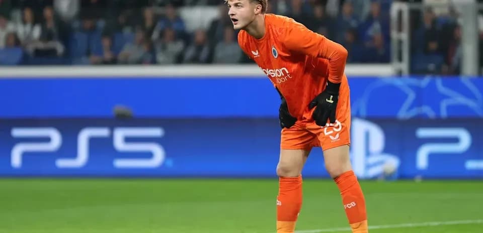 Goalkeeper in orange kit preparing during match