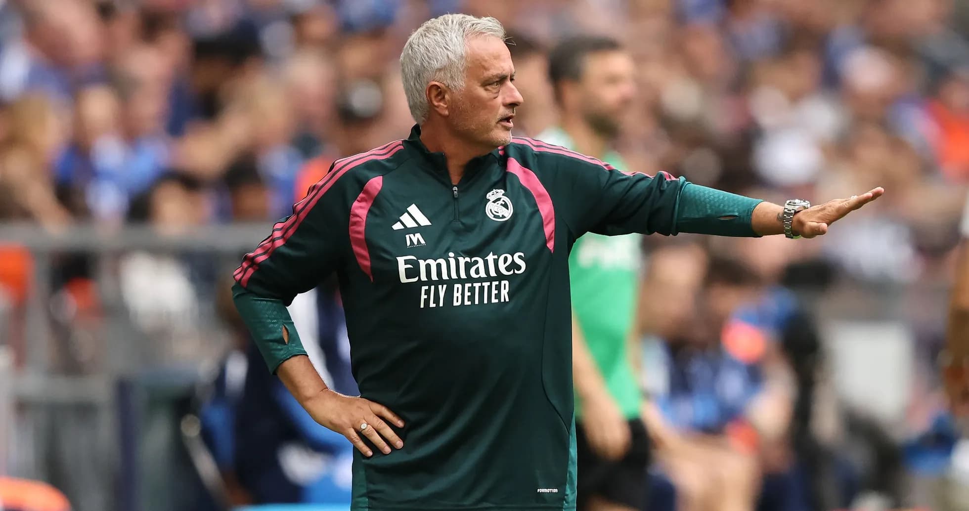 Manager directing players during match on sidelines