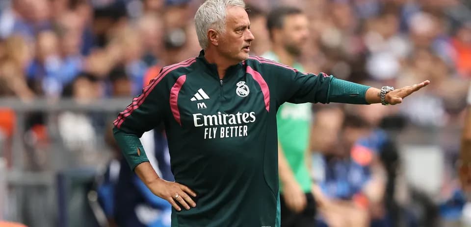 Manager directing players during match on sidelines