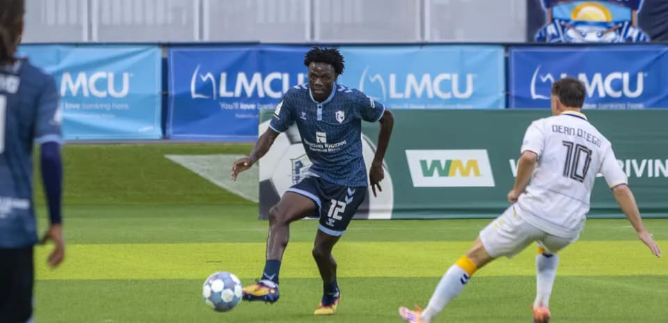 Player dribbling during Naples vs Sarasota match