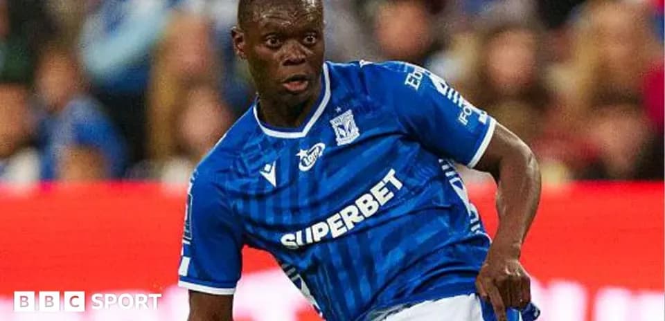 Player in blue jersey dribbling during match