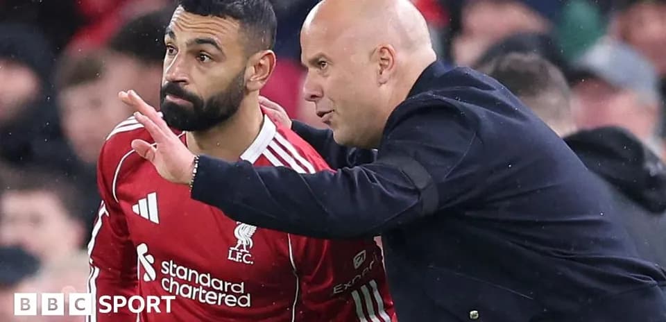 Player receiving tactical instructions from coach on sidelines