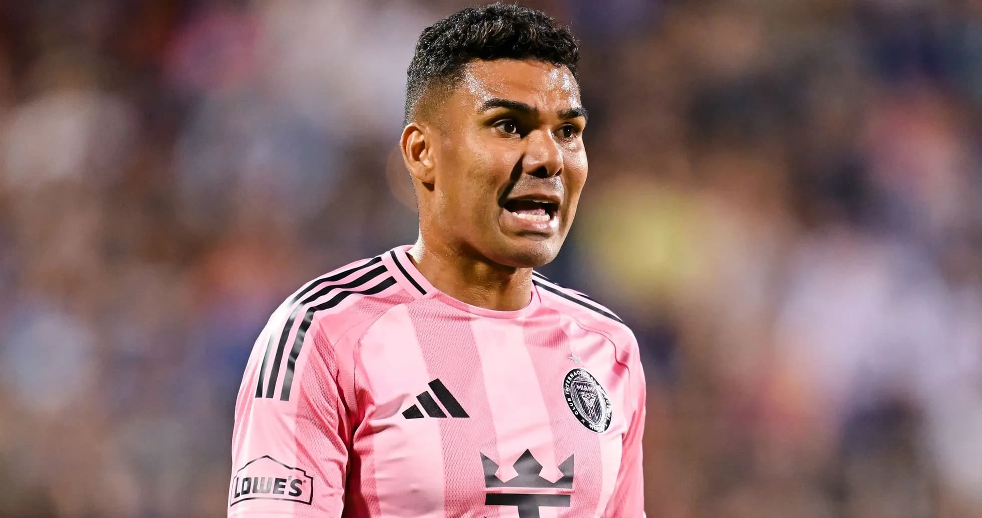 Player wearing pink jersey during match action