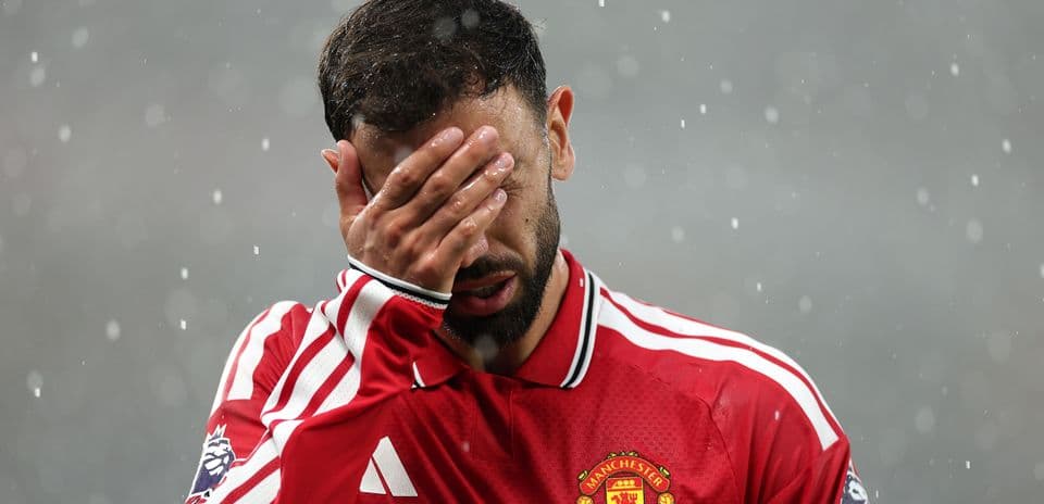 Player covering face with hand during match