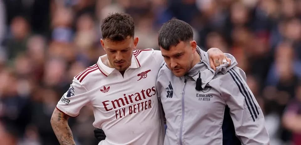 Player receiving assistance off the field after injury