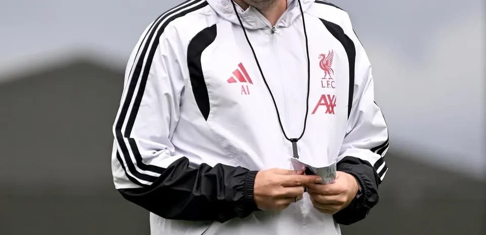 Assistant coach walking during training session
