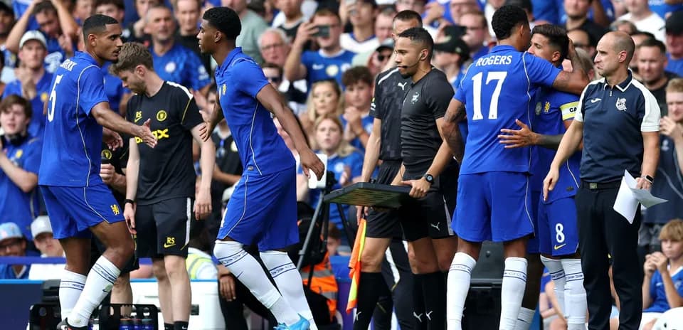 Players substituting during a football match at stadium