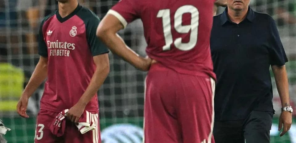 Players and coach reacting after a match loss