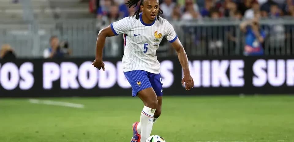 Player dribbling the ball during football match