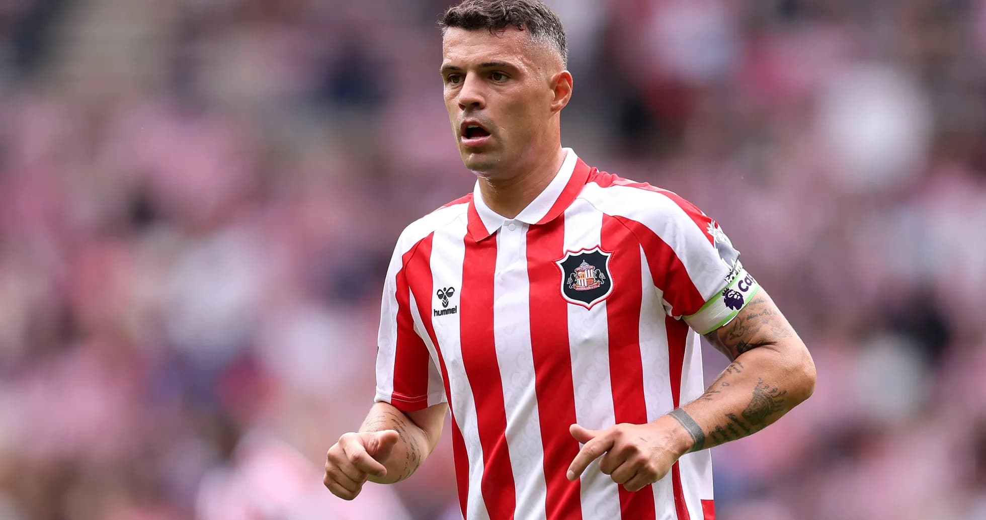 Sunderland player in red and white striped jersey