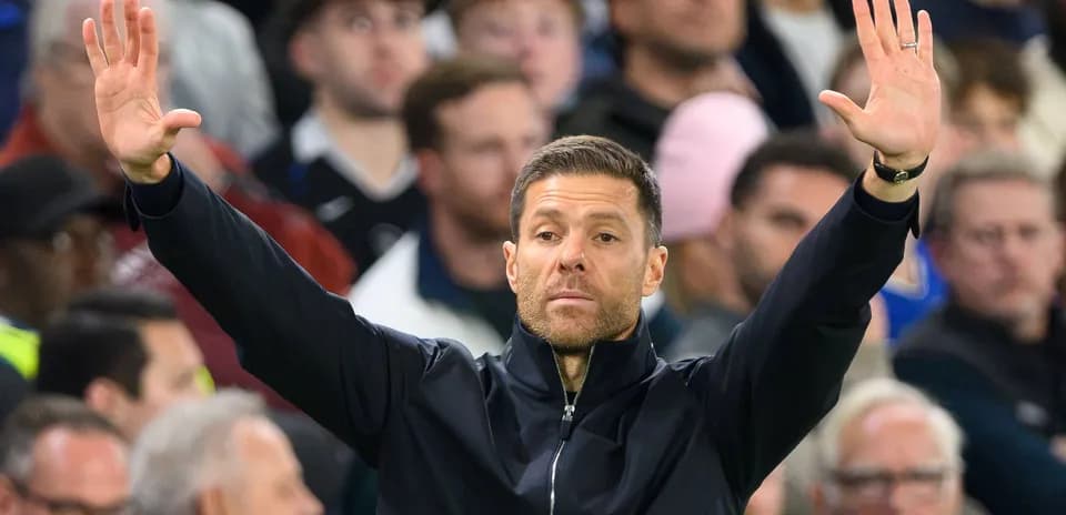 Coach signaling instructions from the sidelines during match