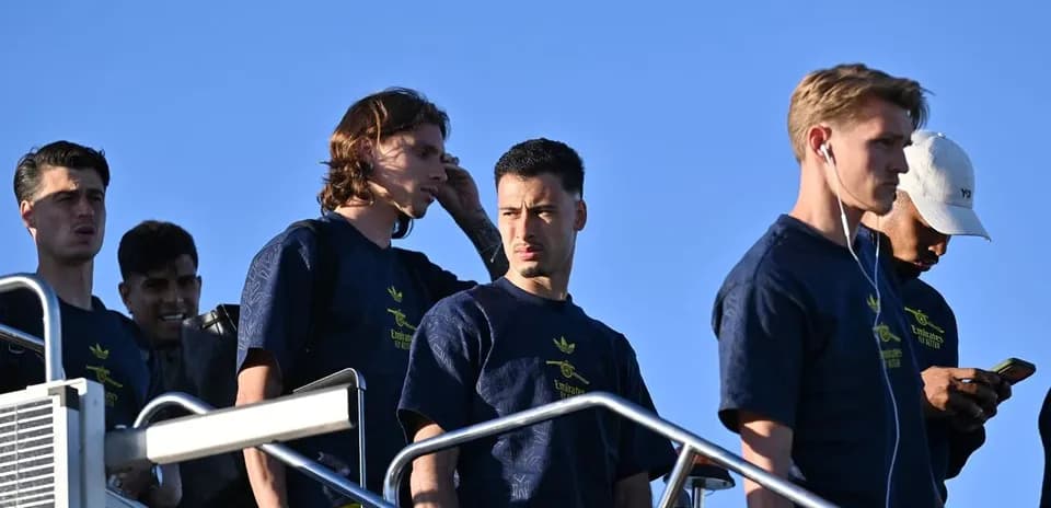 Players walking down steps in team shirts
