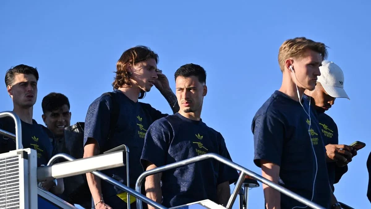 Players walking down steps in team shirts