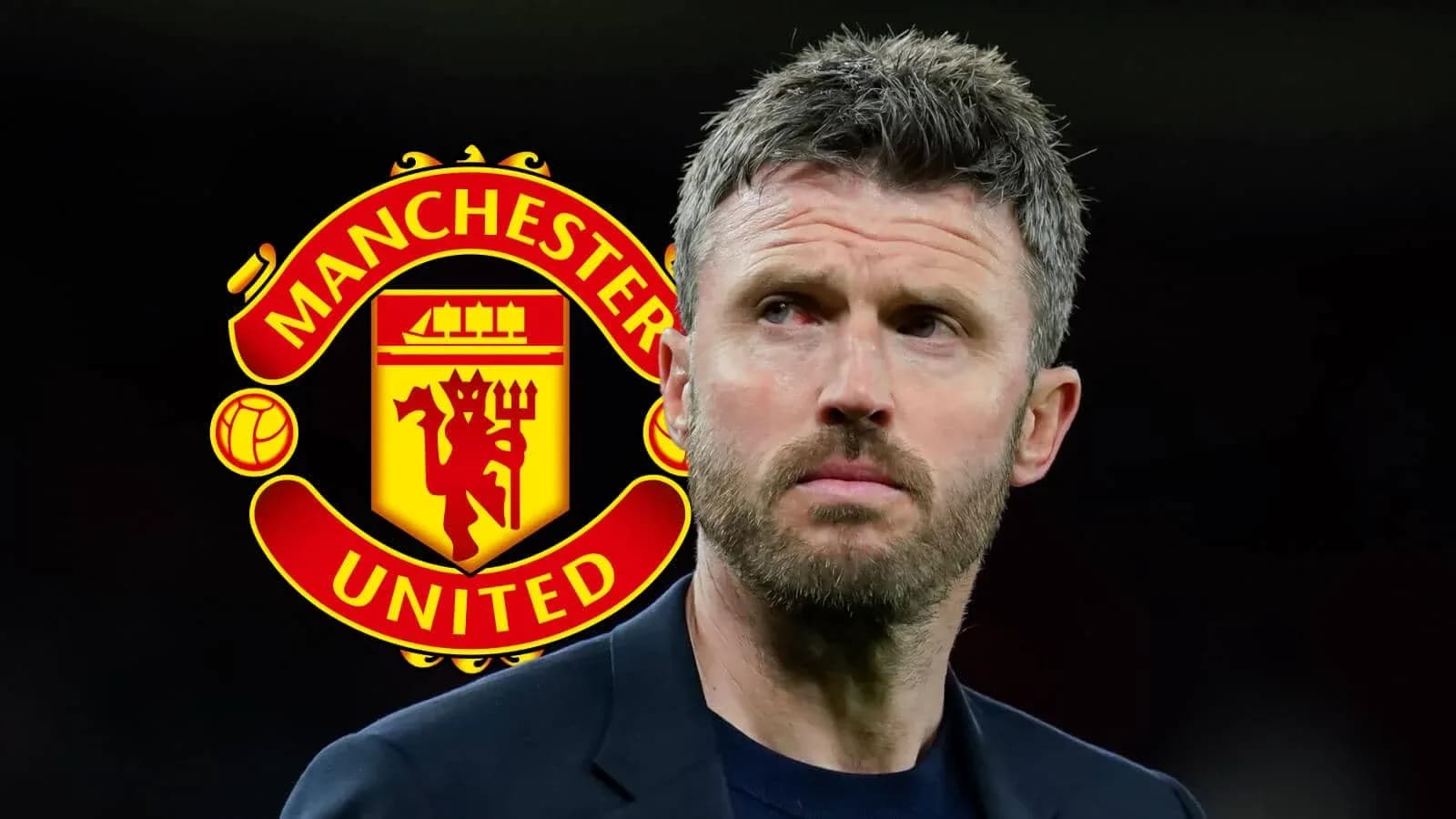 Man standing in front of Manchester United logo