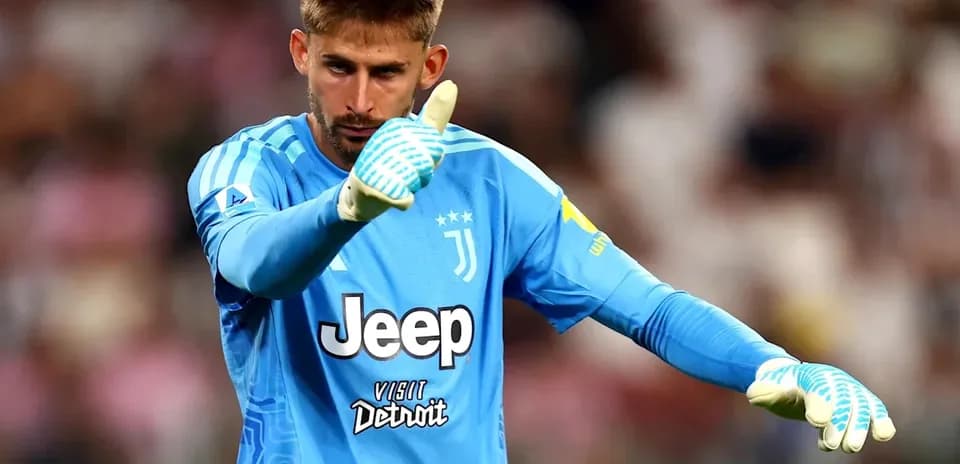 Goalkeeper in blue kit gesturing during match