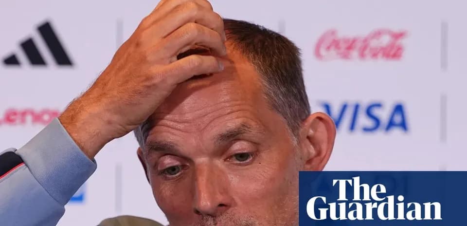 Manager speaking at press conference with hand on head
