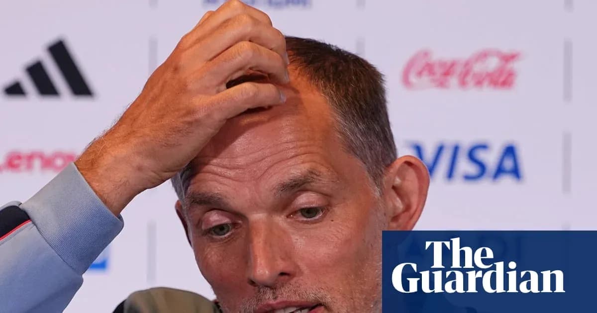 Manager speaking at press conference with hand on head