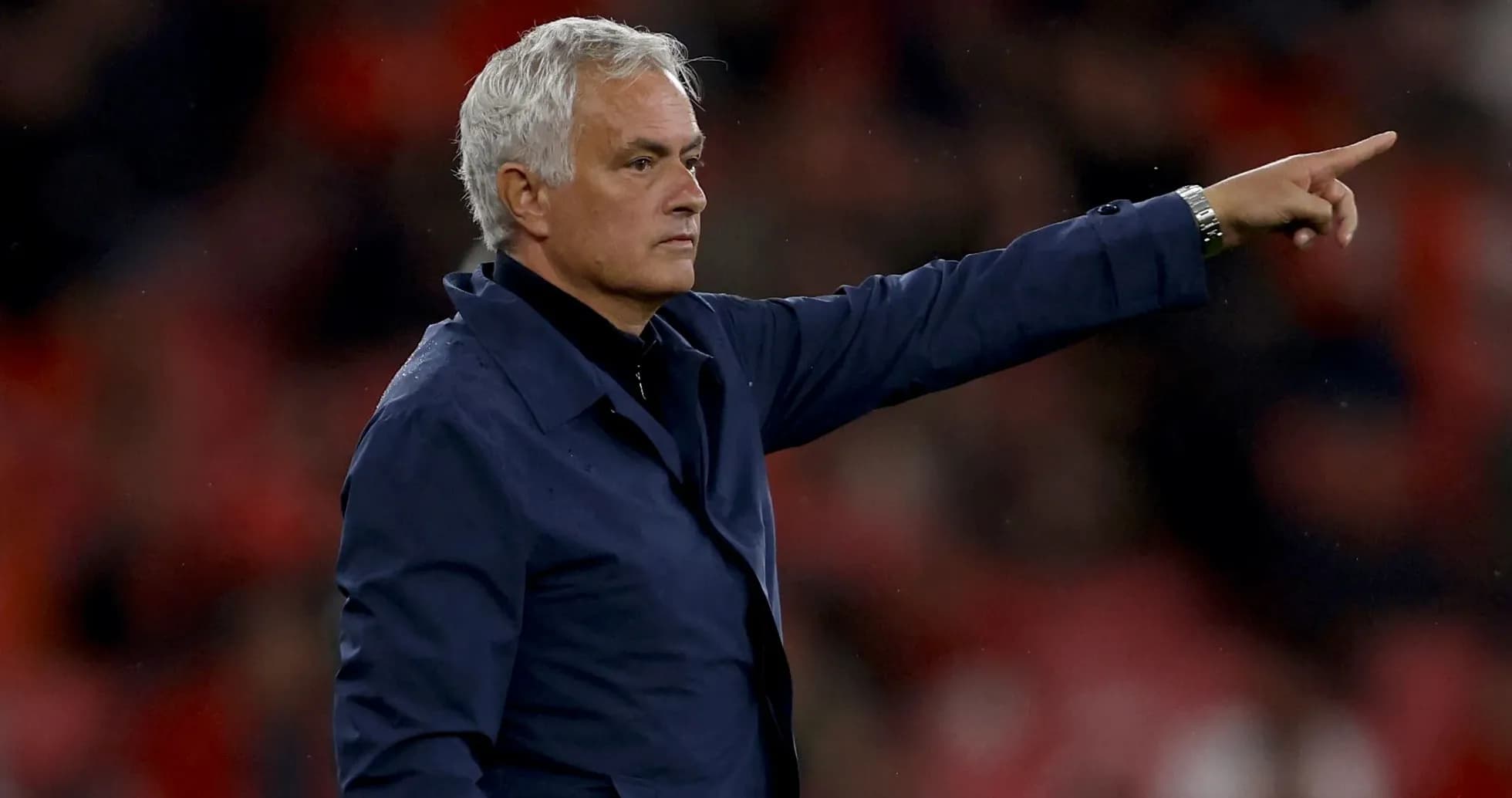 Manager directing players from the sideline during match