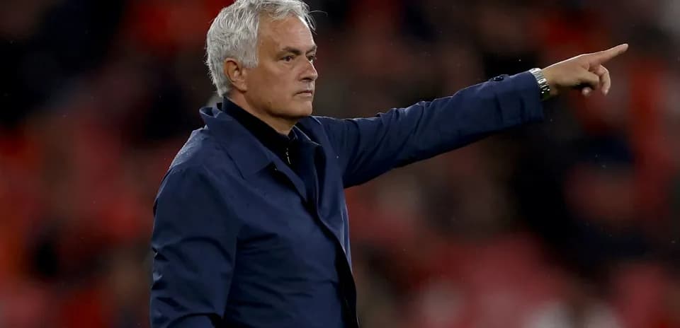 Manager directing players from the sideline during match