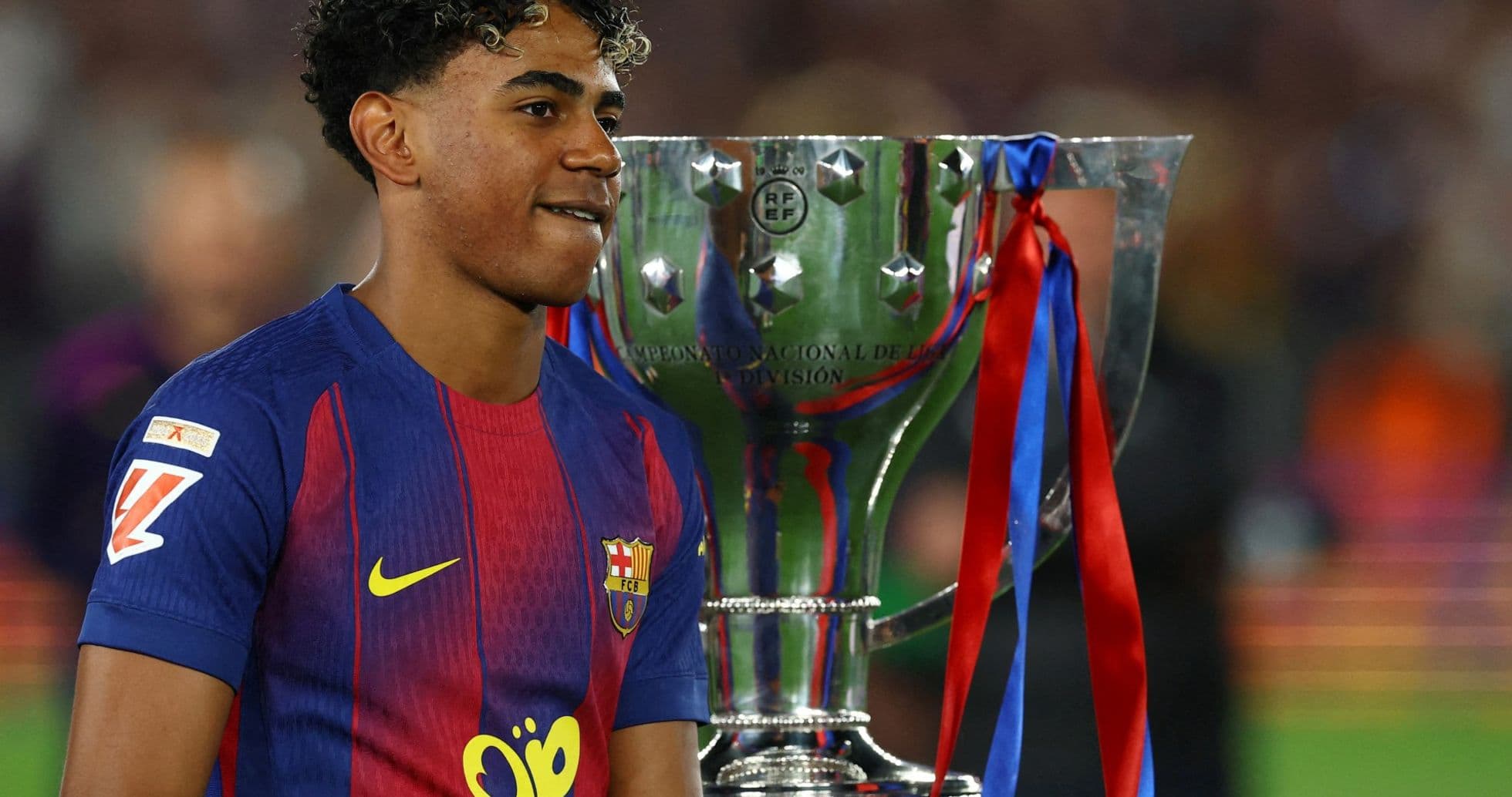 Player celebrating with trophy after winning championship