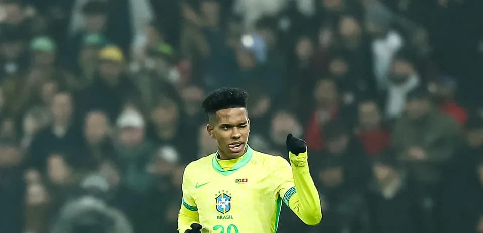 Player celebrating in Brazil's yellow jersey during match