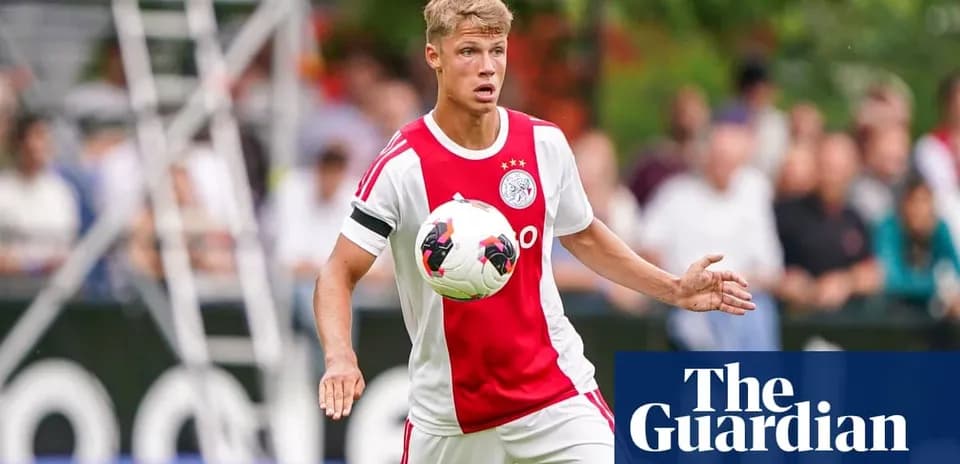Player in Ajax kit controlling the ball during training