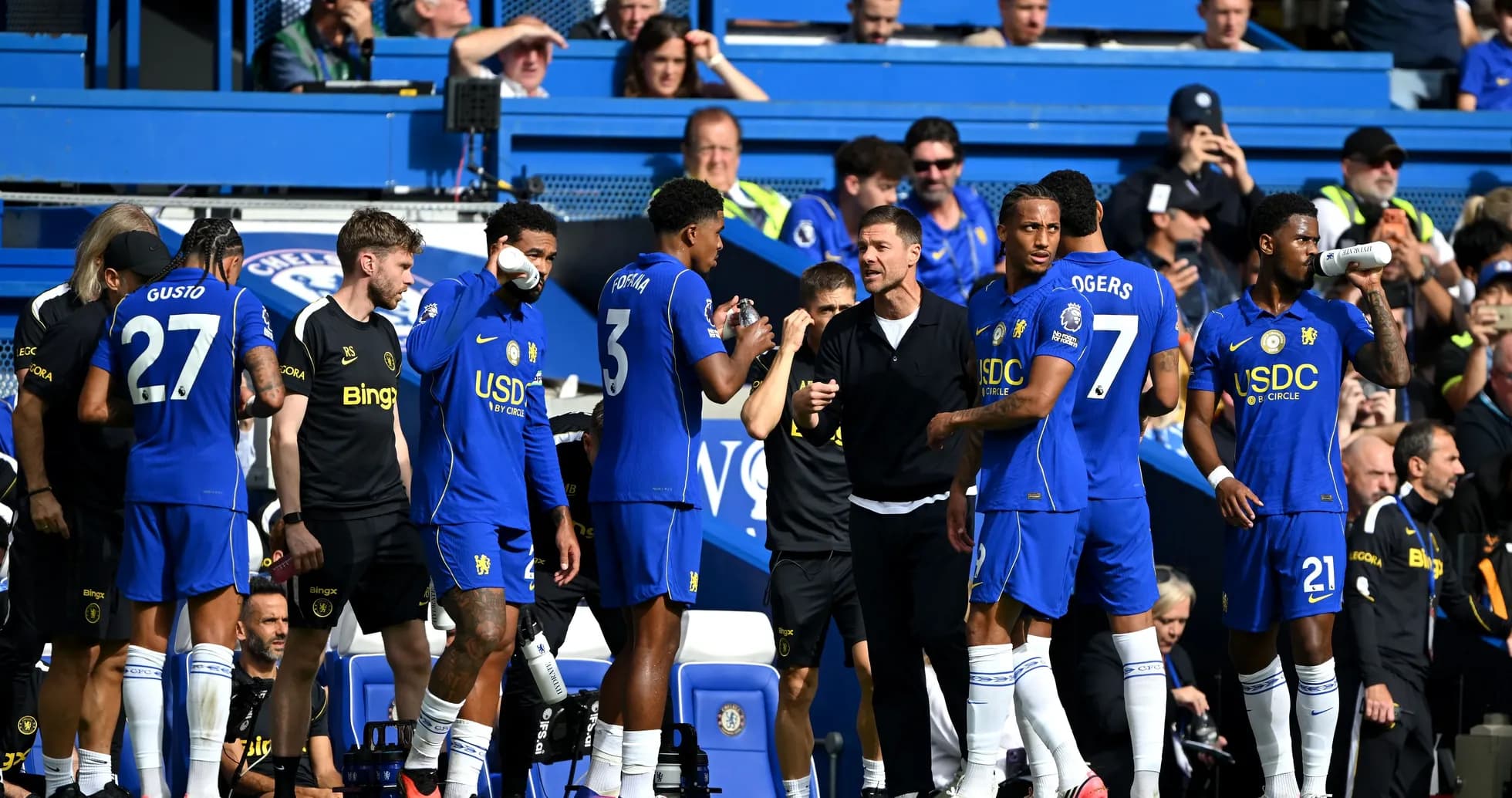 Chelsea players on the sidelines during a match