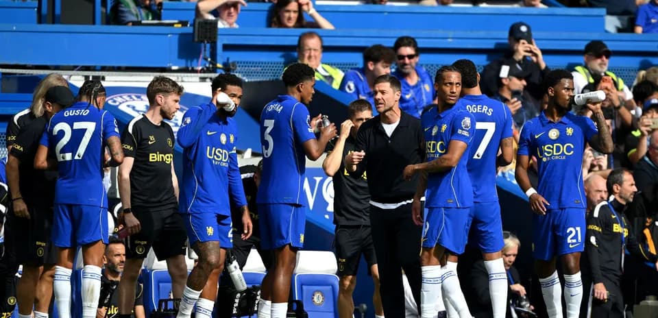 Chelsea players on the sidelines during a match