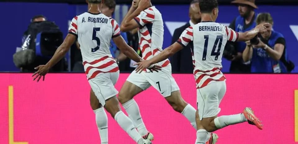 Players celebrating a goal during a match