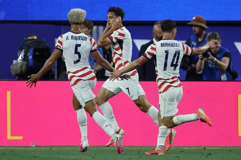 Players celebrating a goal during a match