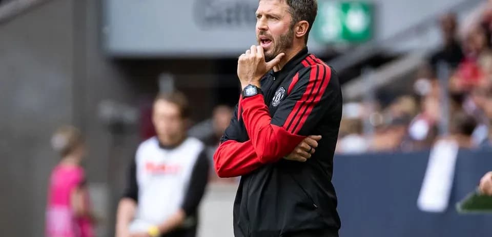 Coach observing match from the sidelines