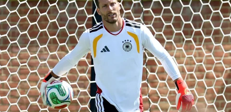 Goalkeeper holding soccer ball in training session